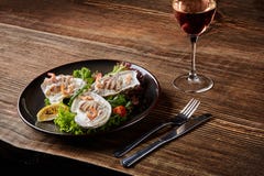 Seafood. Restaurant cuisine, healthy delicatessen food. Oysters, shrimps, octopus in white cream sauce in the shell of royalty free stock photography Seafood. Restaurant cuisine, healthy delicatessen food. Oysters, shrimps, octopus in white cream sauce in the shell of royalty free stock photography