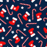 Seamless Christmas pattern with xmas socks, stars and candy canes. royalty free illustration Seamless Christmas pattern with xmas socks, stars and candy canes. royalty free illustration