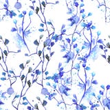 Seamless floral pattern with watercolor hand-draw blue flowers on the branches with blue leaves painted with blots