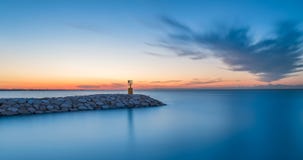 Seascape sunset with purple sky and sea. Long exposure royalty free stock images Seascape sunset with purple sky and sea. Long exposure royalty free stock images