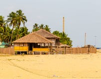 Seaside thatched huts on Awolowo beach Lekki Lagos Nigeria