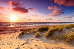 Seaside With Sand Dunes At Sunset Stock Photos