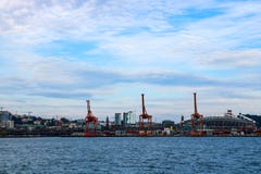 Seattle, USA, August 31, 2018: Port of Seattle at sunset with cargo cranes and CenturyLink field royalty free stock image Seattle, USA, August 31, 2018: Port of Seattle at sunset with cargo cranes and CenturyLink field royalty free stock image