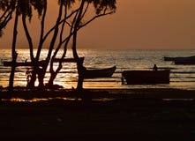 sunset with fishing boats & others royalty free stock photos sunset with fishing boats & others royalty free stock photos