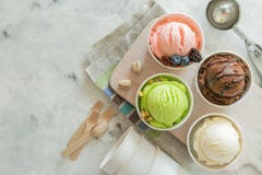 Selection of colorful ice cream scoops in paper cones Royalty Free Stock Photos Selection of colorful ice cream scoops in paper cones Royalty Free Stock Photos