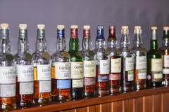 BALLINDALLOCH, MORAY / SCOTLAND - AUGUST 24, 2016: Bottles of a selection of The Glenlivet Single Malt Scotch Whisky stock photo BALLINDALLOCH, MORAY / SCOTLAND - AUGUST 24, 2016: Bottles of a selection of The Glenlivet Single Malt Scotch Whisky stock photo
