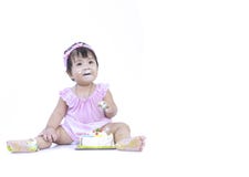 Selective focus at face of Asian baby smear birthday cake on white background royalty free stock photos Selective focus at face of Asian baby smear birthday cake on white background royalty free stock photos