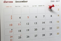 Selective focus of a red push pin marking on calendar date royalty free stock images Selective focus of a red push pin marking on calendar date royalty free stock images