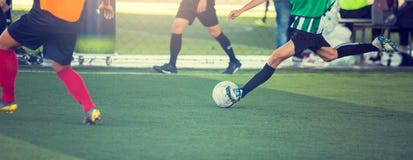Selective Focus To Soccer Player Speed Run To Control And Shoot Ball To Goal Stock Photo