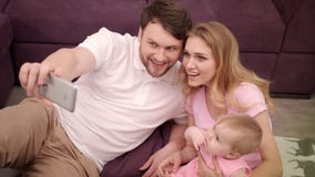 Self photo of happy family with little baby. Togetherness family portrait stock video Self photo of happy family with little baby. Togetherness family portrait stock video