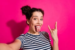 Self Photo Of Curly Wavy Cheerful Rocker Youngster Showing You Rock Horned Fingers Sign Sticking Tongue Out Taking Royalty Free Stock Image