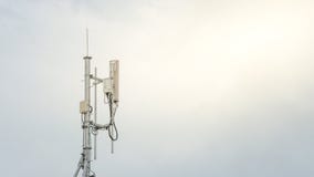 Telecommunication Tower. Cell Phone Signal Tower on sky background stock photos Telecommunication Tower. Cell Phone Signal Tower on sky background stock photos