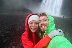 Selfie couple taking smartphone picture waterfall stock photos Selfie couple taking smartphone picture waterfall stock photos