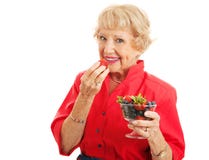 Senhora superior saudável apta Eating Berries imagens de stock Senhora superior saudável apta Eating Berries imagens de stock