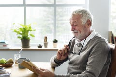 Senior Adult Reading Book Leisure Hobby Concept royalty free stock photography Senior Adult Reading Book Leisure Hobby Concept royalty free stock photography