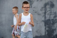The senior boy in a large family is going to school and showing his drawings Royalty Free Stock Photo The senior boy in a large family is going to school and showing his drawings Royalty Free Stock Photo