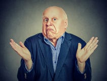 Free Senior Confused Man Is Shrugging His Shoulders Stock Photography - 91480392