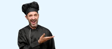 Handsome senior man isolated over blue background stock photos Handsome senior man isolated over blue background stock photos