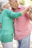Senior Couple Dancing In Countryside Together royalty free stock photography Senior Couple Dancing In Countryside Together royalty free stock photography