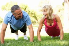 Senior Couple Exercising In Park Stock Photo Senior Couple Exercising In Park Stock Photo