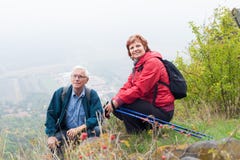 Senior couple hiking and resting in nature stock photos Senior couple hiking and resting in nature stock photos