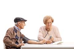 Senior couple measuring blood pressure stock image Senior couple measuring blood pressure stock image