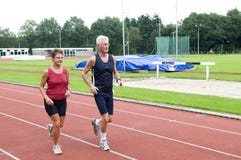Senior Couple Running On A Track Royalty Free Stock Images Senior Couple Running On A Track Royalty Free Stock Images