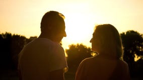 Senior couple silhouette watching sunset together, romantic date in countryside royalty free stock images Senior couple silhouette watching sunset together, romantic date in countryside royalty free stock images