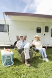 Senior Couple Sit Outside RV Home royalty free stock photo Senior Couple Sit Outside RV Home royalty free stock photo