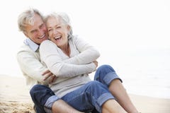 Senior Couple Sitting On Beach Together royalty free stock image Senior Couple Sitting On Beach Together royalty free stock image