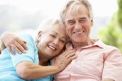 Senior Couple Sitting On Outdoor Seat Together royalty free stock image Senior Couple Sitting On Outdoor Seat Together royalty free stock image