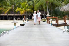 Senior Couple Walking On Wooden Jetty Stock Photography Senior Couple Walking On Wooden Jetty Stock Photography