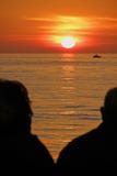 Senior couple watching sunset Royalty Free Stock Photos Senior couple watching sunset Royalty Free Stock Photos