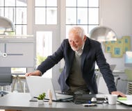 Senior engineer working with computer at office stock photos Senior engineer working with computer at office stock photos