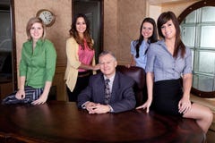 Senior executive with team of young women stock image Senior executive with team of young women stock image