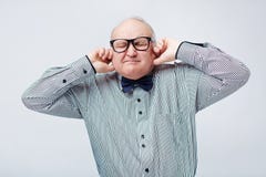 ST on talkSPORT tonight. Senior-looking-silence-waist-up-portrait-elegant-elderly-man-striped-shirt-bow-tie-plugging-his-ears-fingers-87429840