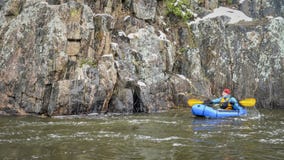 Packraft paddling in snowstorm royalty free stock photos Packraft paddling in snowstorm royalty free stock photos