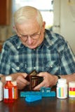 Senior Male Spent Money On Medicine Royalty Free Stock Images
