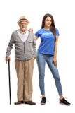 Senior man with a cane and a young woman volunteer posing royalty free stock image Senior man with a cane and a young woman volunteer posing royalty free stock image