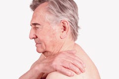 Senior man with pain in the shoulder stock photos Senior man with pain in the shoulder stock photos