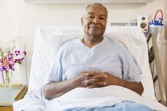 Senior Man Sitting In Hospital Bed stock image Senior Man Sitting In Hospital Bed stock image