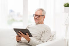 Senior man with tablet pc at home royalty free stock image Senior man with tablet pc at home royalty free stock image