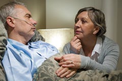 Senior patient at hospital with worried wife