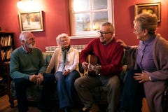 Senior people making party smiling and enjoy together at home royalty free stock photos Senior people making party smiling and enjoy together at home royalty free stock photos