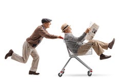 Senior pushing a shopping cart with another senior with a newspaper riding inside royalty free stock photos Senior pushing a shopping cart with another senior with a newspaper riding inside royalty free stock photos