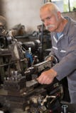 Senior technician repairing and checking engine stock photography Senior technician repairing and checking engine stock photography