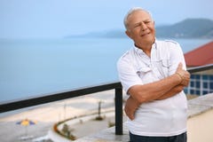 Senior on veranda near seacoast royalty free stock photos Senior on veranda near seacoast royalty free stock photos