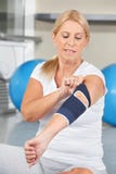 Senior woman with bandage on elbow stock images Senior woman with bandage on elbow stock images