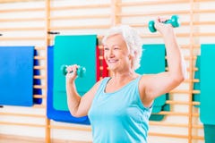 Senior woman doing fitness sport in gym royalty free stock images Senior woman doing fitness sport in gym royalty free stock images