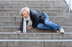 Senior woman falling down stone steps outdoors Royalty Free Stock Photo Senior woman falling down stone steps outdoors Royalty Free Stock Photo